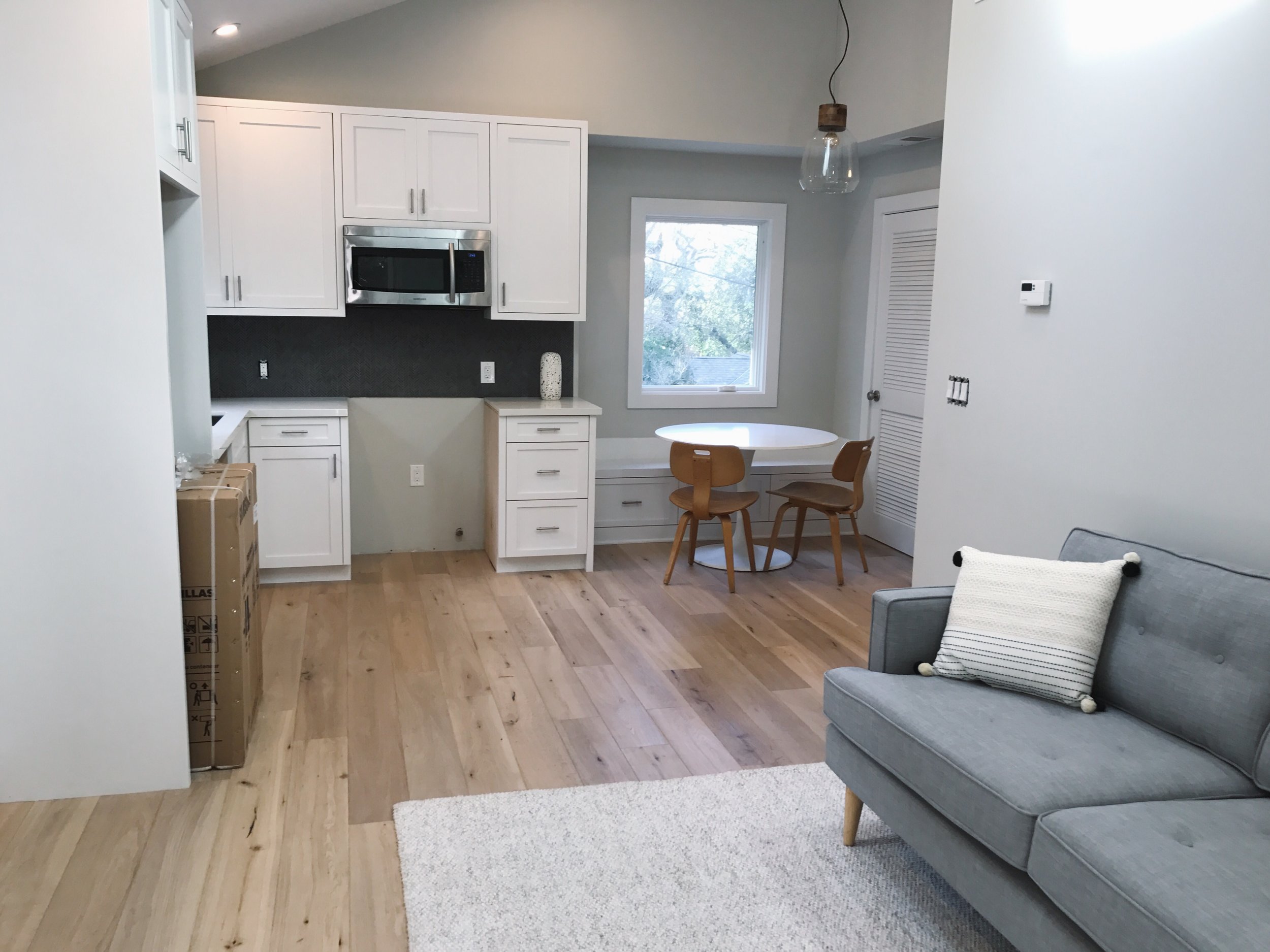  An open living space and vaulted ceilings can make a world of difference in a small space. (Appliances haven't been installed yet.) 